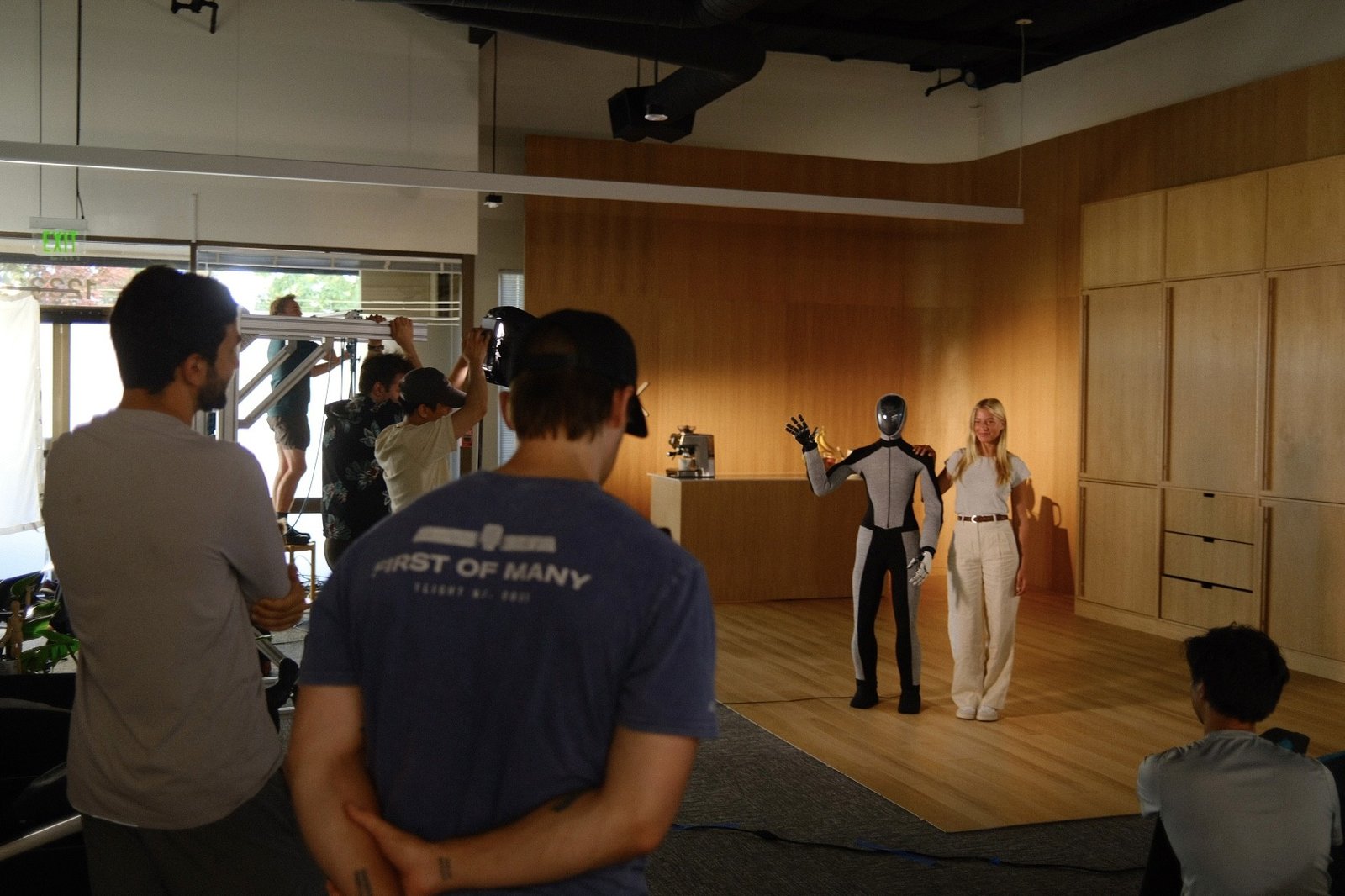 Lil B the Based God and Eric Jang, head of AI at 1X, with Eve and a Cybertruck
