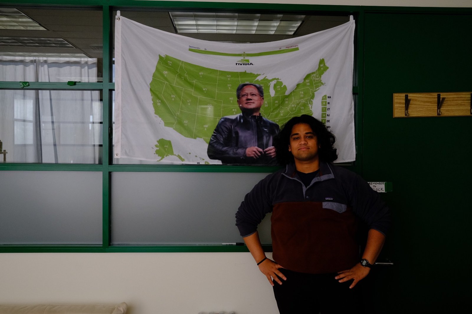 Rahul Sonwalker with a Jensen banner at the Julius office
