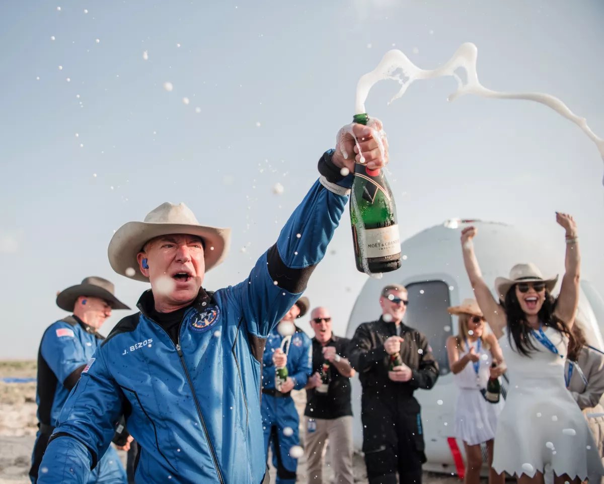 Jeff Bezos (founder of Amazon and Blue Origin) celebrating after going to space on his company’s first crewed rocket flight